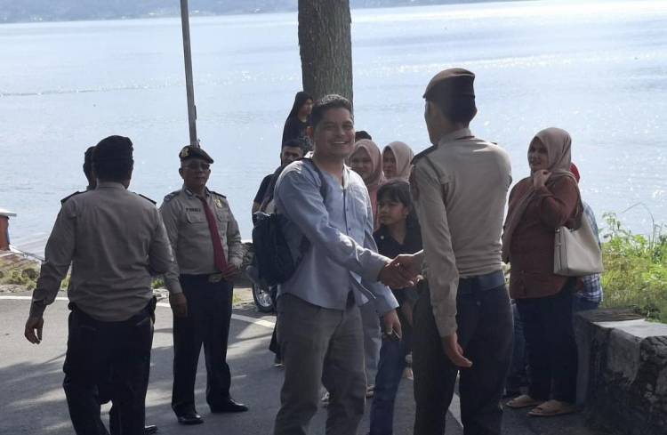 Aipda Roland Manik Intensifkan Patroli Pengamanan di Objek Wisata Danau Toba