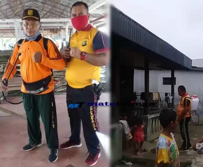 Polsek Teluk Nibung Bersama  Warga Masyarakat Semprot Lingungan Pemukiman Dengan Desinfektan