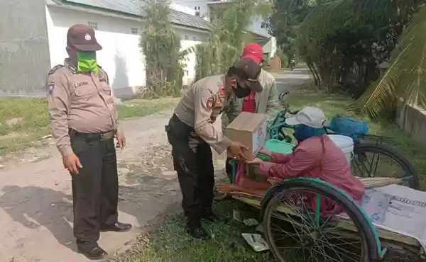 Kapolres Tebingtinggi Beri Bantuan Sembako Pasutri Penjual Jagung Rebus