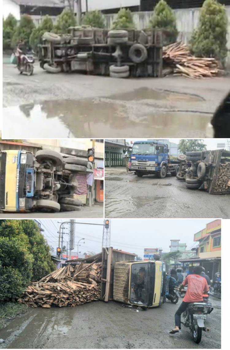 Jalan Rusak Gulingkan Truk Muatan Kayu Sempengan