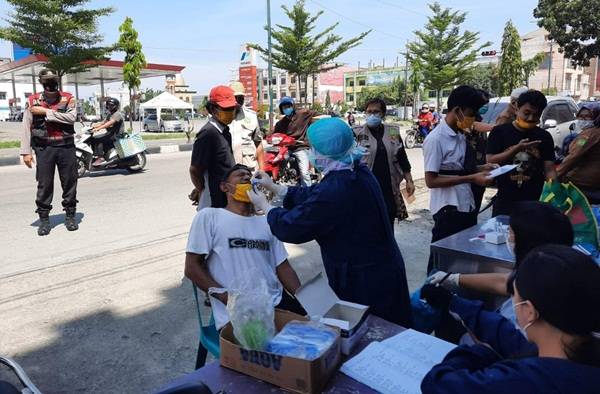 Brimob Polda Sumut Rutin Laksanakan Yustisi Razia Masker