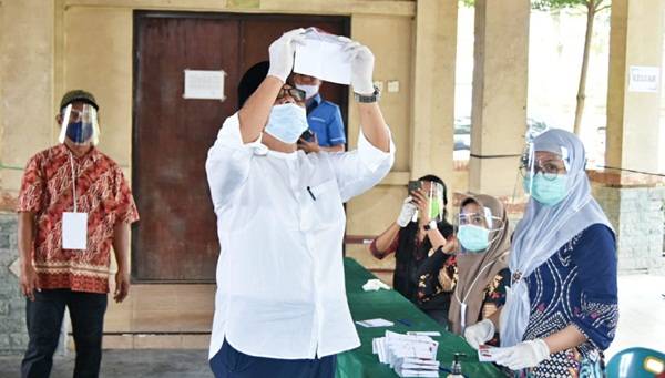 Bupati dan Wakil Bupati Sergai  Gunakan Hak Suara Pada Pilkada Serentak 2020