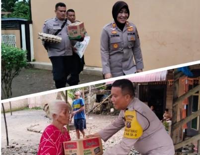 Kapolsek Nasembilan-sepuluh Salurkan Bansos kepada Warga Desa Simpang Marbau